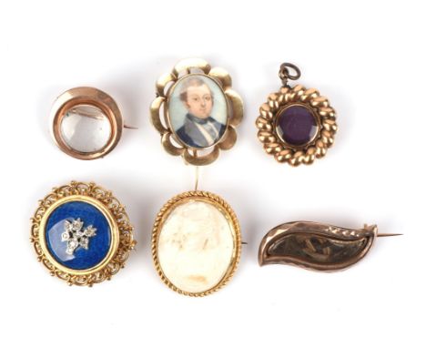 Six antique pendant brooches, including a diamond set blue enamel and openwork brooch in 9 ct, a hairwork brooch in 9 ct, a p
