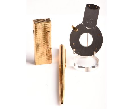 A Dunhill cigar cutter in white and yellow metal in a fitted box, a Dunhill lighter with patent stamp "US.RE 24163", and a Du