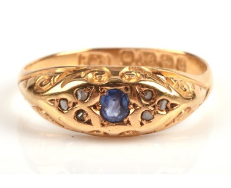 Sapphire and diamond ring, with a central oval cut sapphire with three rose cut diamonds each side, set in 18 ct gold, hallma