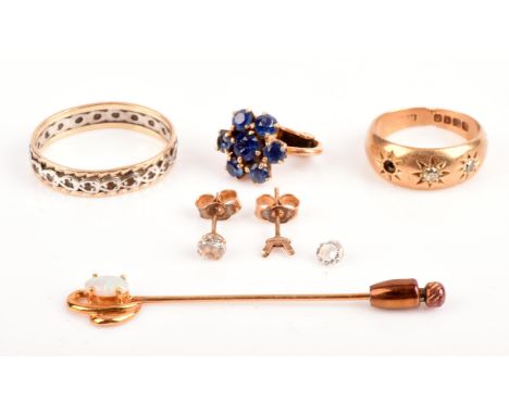 A group of gold items, including a diamond set gypsy ring in 18 ct gold hallmarked London 1916, an opal set stick pin in yell