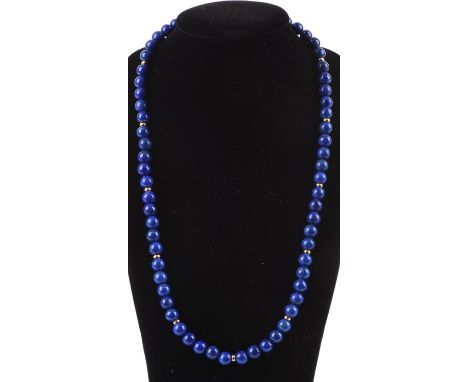 Lapis lazuli jewellery, including a large oval pendant with articulated bail, 5 x 3.1cm, a round cabochon cut ring, size K 1/