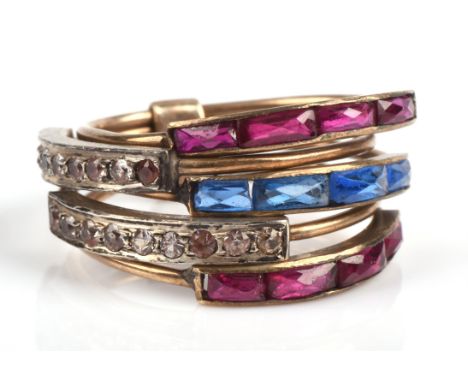 Harem ring with paste stones consisting of five bands, with red, blue and white pastes, in base metal, ring size K 1/2.Condit