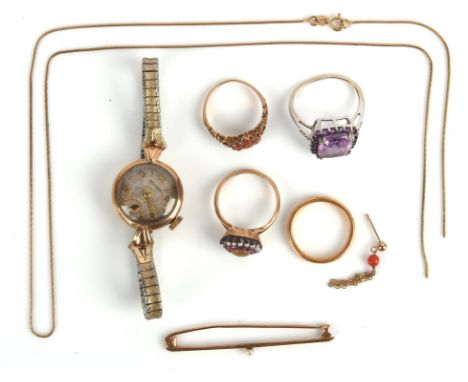 Group of jewellery including a 22 ct wedding band, size M, a 9 ct gold cased Movado watch, a coral ring, size M, an amethyst 