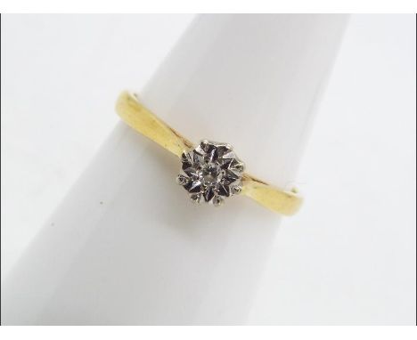 A hallmarked 18 carat yellow and white gold illusion set single stone diamond ring, approximately 05 pts, size M, approx 2.21