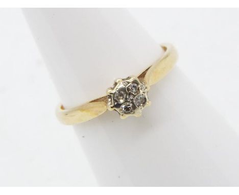 A 9 carat yellow gold cluster ring, the crown set with four 5-point stones, size K+½, approx 1.89 gm