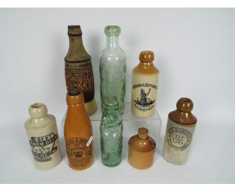 A collection of vintage stoneware and glass bottles to include Britannia Brewing Co Liverpool, M Walker &amp; Sons Ltd Frogha