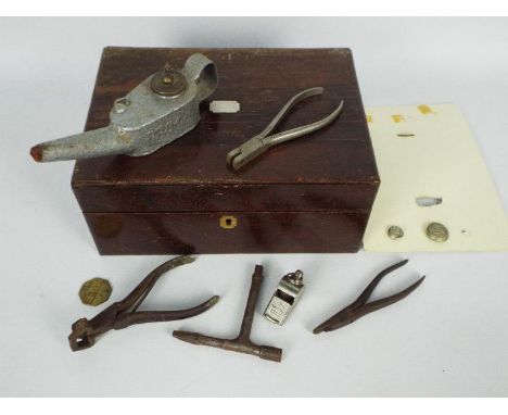 Railwayana - A box of mixed items to include a BR(M) flare lamp, LNWR brass pay check token, ticket punch and whistle stamped