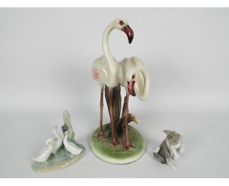 An Austrian ceramic group of two flamingos, marked to the base Wien Keramos, approximately 31 cm (h) and a Lladro group and a
