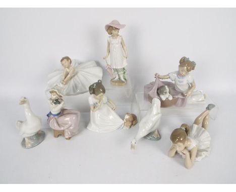 A collection of Nao figurines, children, animals, ballerinas, largest approximately 20 cm (h).
