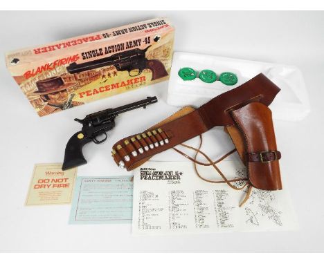 A blank firing Single Action Army .45 Peacemaker 1873 Model contained in original box, with three tubs of blank cartridges an