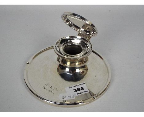 A large George V silver capstan inkwell with clear glass liner, Birmingham assay 1923, sponsors mark for A &amp; J Zimmerman,