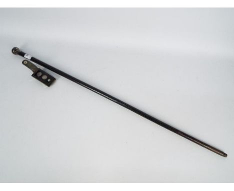 A silver topped walking stick and a set of two sterling silver golf ball markers contained in leather case. [2]