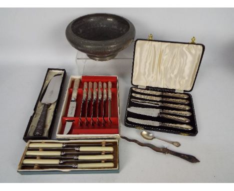 A cased set of six silver handled butter knives, silver handled cake slice, silver coffee spoon, white metal letter opener st