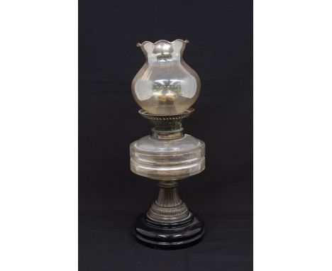 An early 20th Century Hinks Triple table top oil lamp with glass body and shade