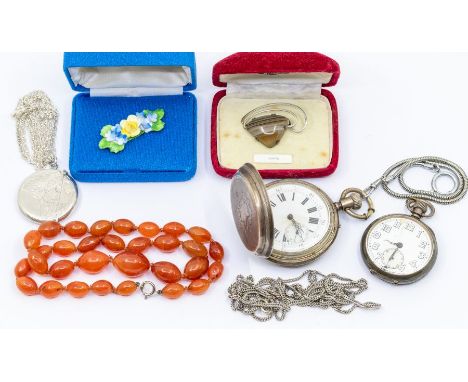 A circular engraved match striker mounted as a pendant on a silver chain, (dented) along with a silver pocket watch A/F damag