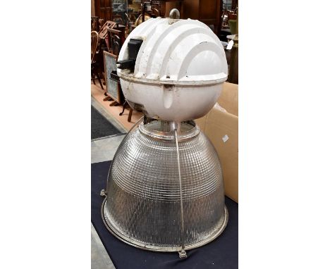 A large industrial prismatic light fitting - bulb present and socket