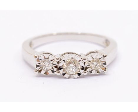 A diamond and 18ct white gold comprising three graduated diamonds illusions set, total diamond weight approx 0.25ct, size N, 