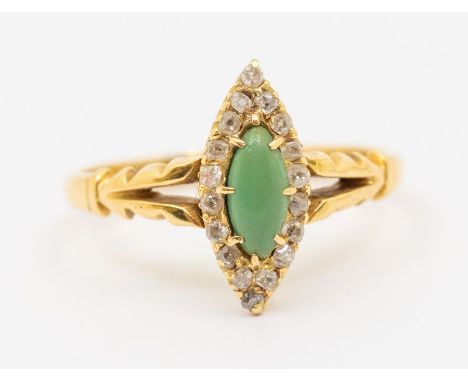 A diamond and turquoise type 18ct gold ring, comprising a marquise shaped setting, turquoise set to the centre within a borde