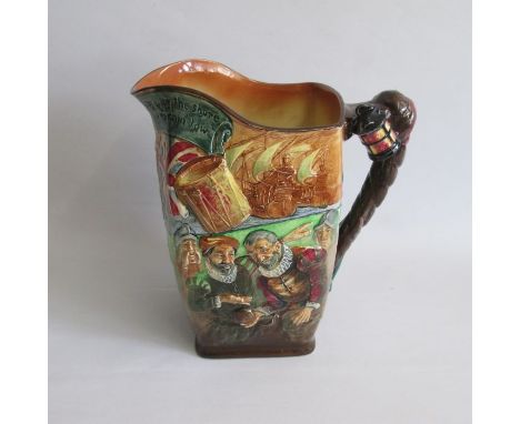 A large Royal Doulton Drake Jug, one side Depicting the Queen and other subjects before the ‘Golden Hind’ The other side Play
