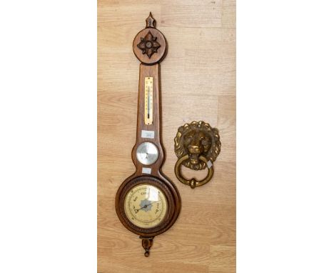 A Weathermaster barometer; a brass lion mask door knocker (2)
