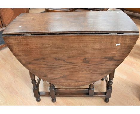 1930s / 40s dark oak oval topped three shelf dresser with two cupboard doors, oak chest of four drawers, mid 20th century oak