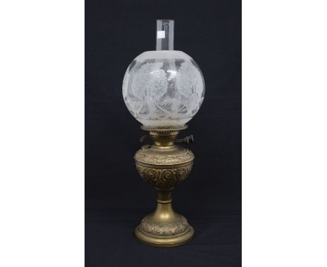 A late Victorian brass oil lamp with etched glass shade and funnel