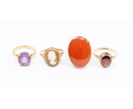 Four 9ct gold stone set rings including carnelian, amethyst, garnet and a cameo ring, sizes M, M1/2, O, P1/2, combined total 