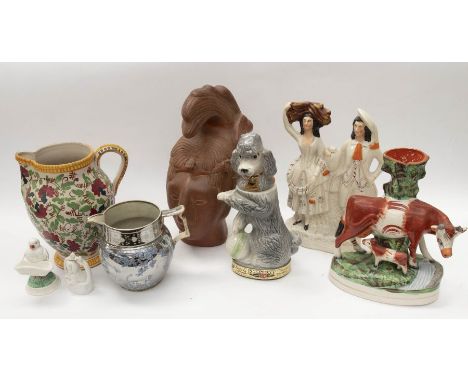 A collection of 19th Century Staffordshire figures, water jugs including a Barge ware teapot