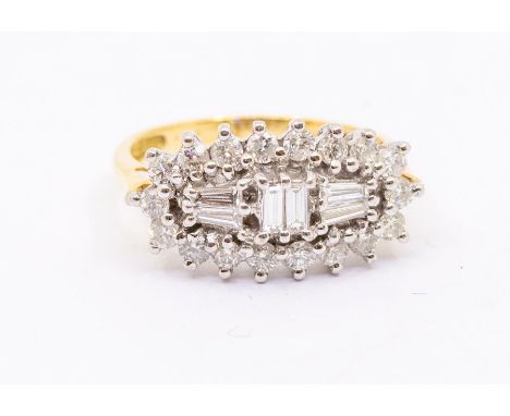 A diamond and 18ct gold cluster ring, lozenge shaped cluster set with baguette and tapered baguette cut diamonds within a bor