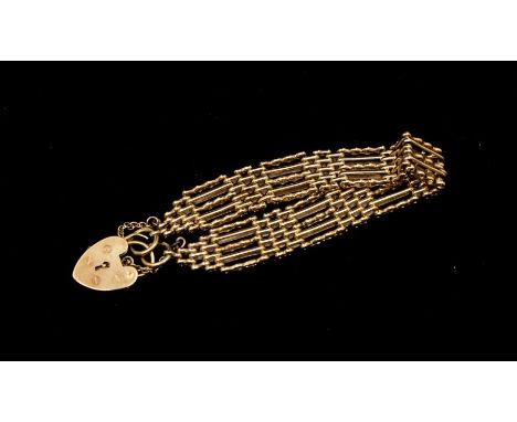 A 9ct gold fancy link gate bracelet, width approx 13mm, length approx 17mm, padlock clasp, weight approx 23.5gms Further deta
