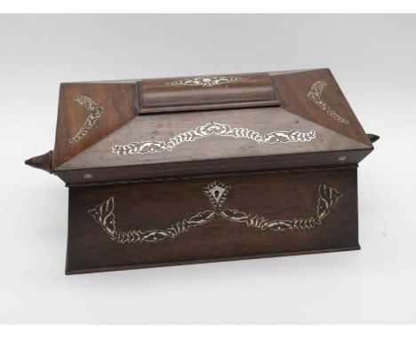 A Victorian inlaid rosewood and mother-of-pearl sarcophagus shaped tea caddy and cover, fitted interior, mixing bowl and feet