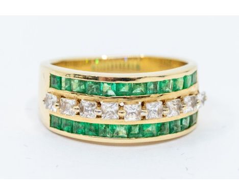 An emerald and white stone three row 14ct gold ring, comprising a single row of French cut white stones, possibly white sapph