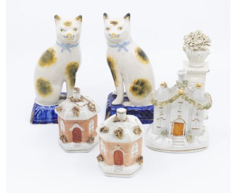 A collection of Staffordshire money boxes, ceramic houses, cream wares and early 20th Century cats AF