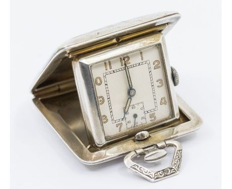 An Art Deco silver miniature travel clock, the silvered dial with painted Arabic numbers markers, square subsidiary dial at 6