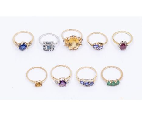 A collection of eight 9ct gold and gem set rings to include gem set rings, including a sapphire doublet and diamond ring, cit