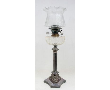 An early 20th Century plated oil lamp, fluted column stand of tripod support, stamped Walker &amp; Hall to underside, glass r