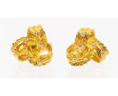 A pair of diamond mid century diamond and gold earrings, textured interwoven leaf motifs interspersed with small claw set rou