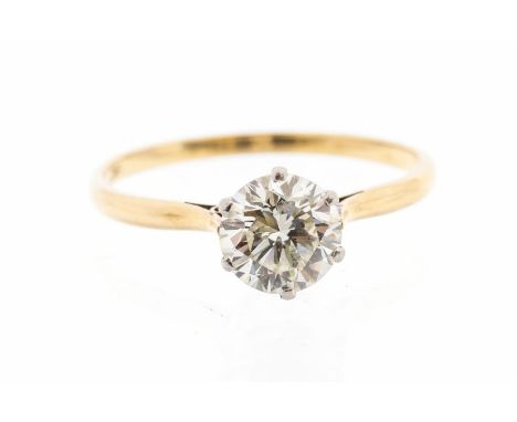 A diamond and 18ct gold solitaire ring, comprising a claw set round brilliant cut diamond weighing approx 1.50ct, assessed co