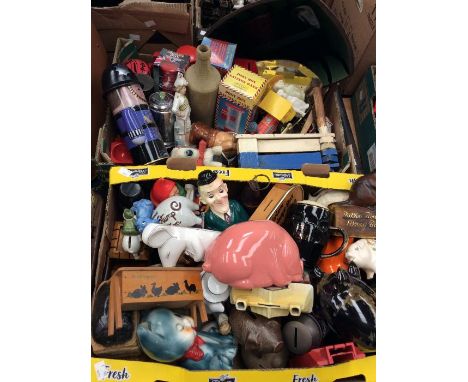 A collection of money banks, ceramic and wooden, tins, early 20th Century figures, brass and treen etc