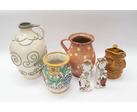 A collection of late 19th Century stone ware pots, bottles, jelly moulds, vases, teapots, Toby jugs etc to include C H Branna