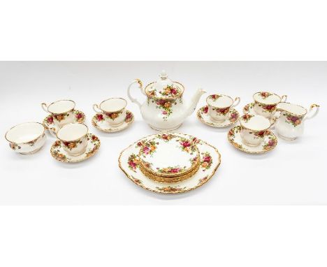 A Royal Albert Old Country Roses pattern tea service including four cups and saucers, teapot, side plates, milk and sugar and