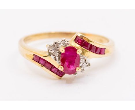 A ruby and 9ct gold dress ring, comprising a central claw set oval cut ruby approx 4 x 6mm, diamond accents set to the sides 