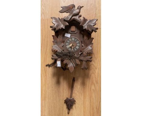 A modern cuckoo wall clock by Albert Schwar Germany. With 2 train movement chiming on a gong. 3" dial case 8" x 12" x 5 1/2" 