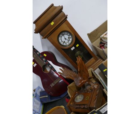 Tall wooden cased mantel clock, 72 cm high, box of clock parts and carved wooden eagle figure