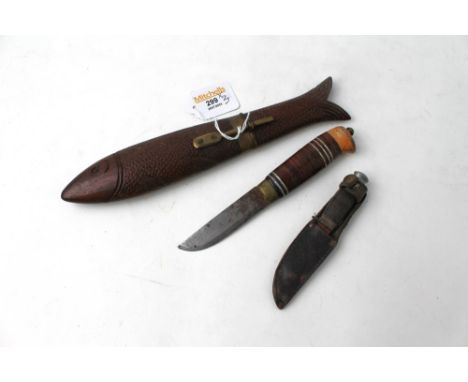 Three vintage knives, one in wooden carved fish sheath This bladed product is not for sale to people under the age of 18.  By