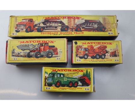 Four boxed Matchbox commercial and construction vehicles to include M4 Fruehauf Hopper Train, K12 Heavy Breakdown/Wreck Truck