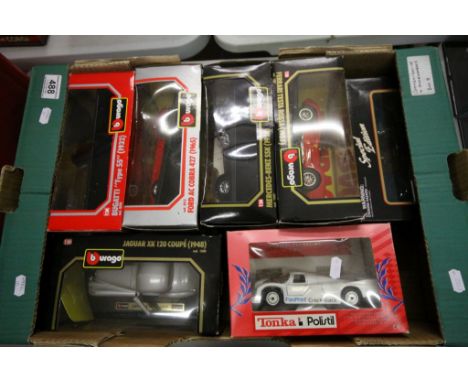 Five boxed 1/24 scale Burago cars comprising Bugatti, Jaguar XX, Ford AC Cobra, Mercedes-Benz SSK, Ferrari Testa Rossa, boxed