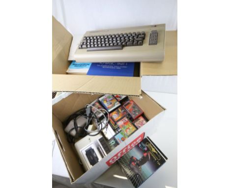 Gaming - Commodore computer console plus 22 cassette games and a boxed Cheetah joystick