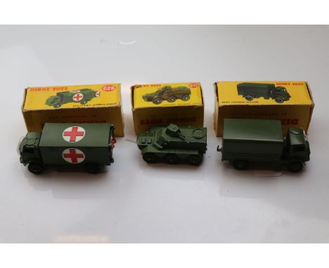 Three boxed Dinky military vehicles to include 623 Army Covered Wagon, 626 Military Ambulance and 676 Armoured Personnel Carr