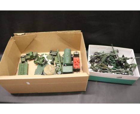 Fourteen Army Guns including Dinky 88mm Gun and Britains plus Dinky Tank Transporter and Dinky, Britains and other Vehicles, 